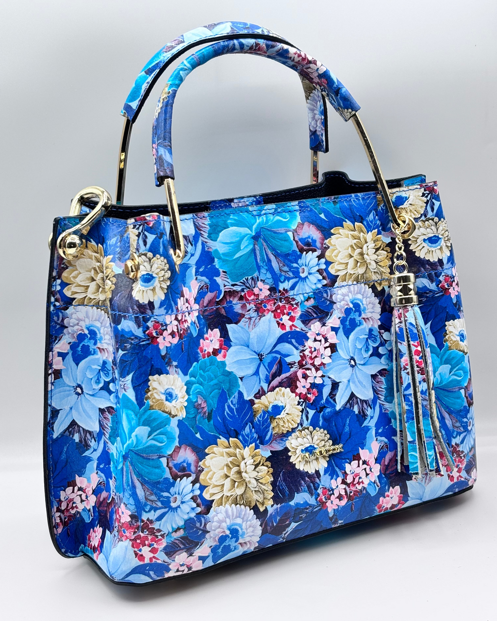 Borsa PAULETTE SPRING da donna in vera pelle martellata made in italy, colore blu floreale, firmata Alaincox, negozio di Genova, con pochette interna con zip, tracolla regolabile e dettagli in acciaio dorato, elegante e capiente per uso quotidiano.
