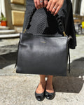 Borsa TRECCIA ALAINCOX Genova in vera pelle martellata Made in Italy, con manico intrecciato removibile, tracolla regolabile, chiusura zip e dimensioni 31x25x11 cm. Nero